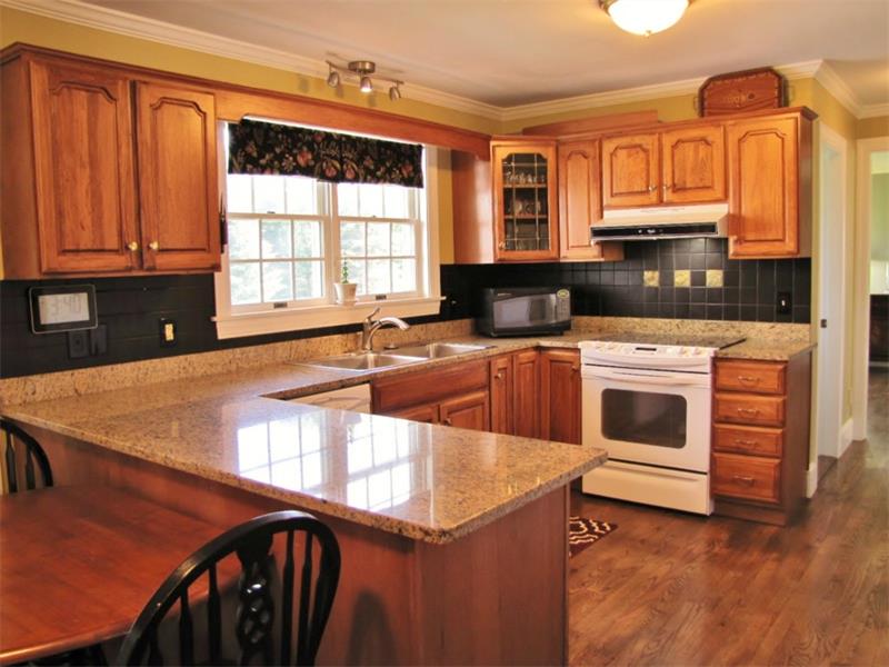 home for sale in Belfast, Maine with a master bedroom suite, bonus room, hardwood floors, attached 2-car garage 
