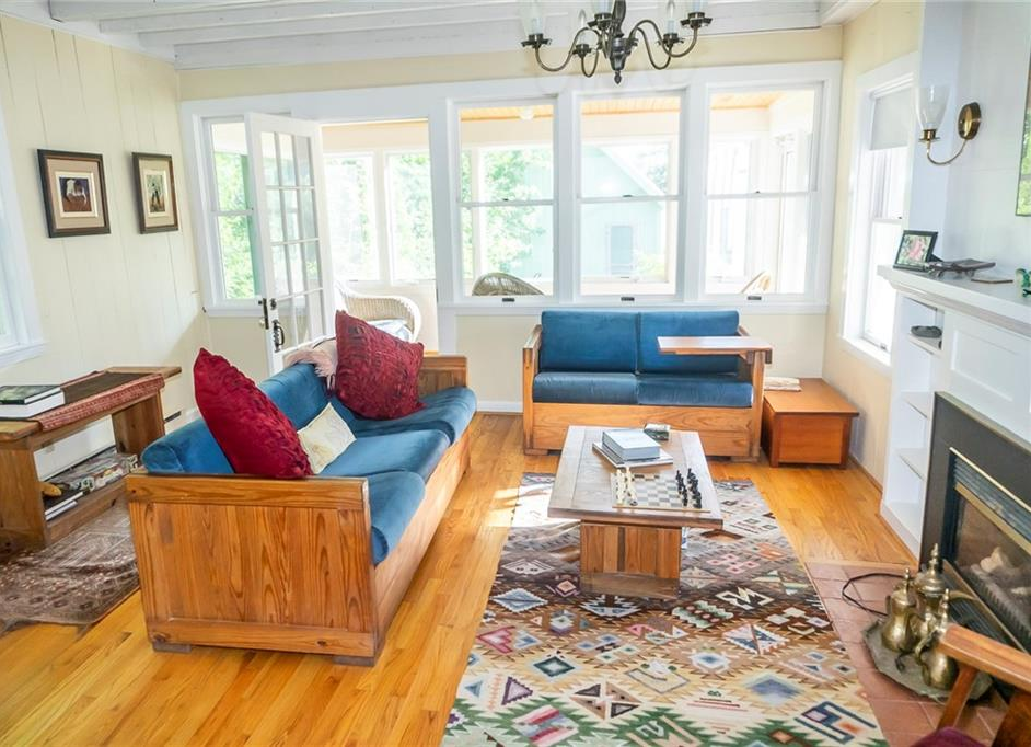 Maine Victorian 3-season cottage has 3 spacious bedroomss, a large sunny kitchen, a cozy living room with a gas fireplace, a big deck for outside 
        entertaining, a heated glassed-in porch and a small, 2-level barn for extra storage - Northport, Maine
