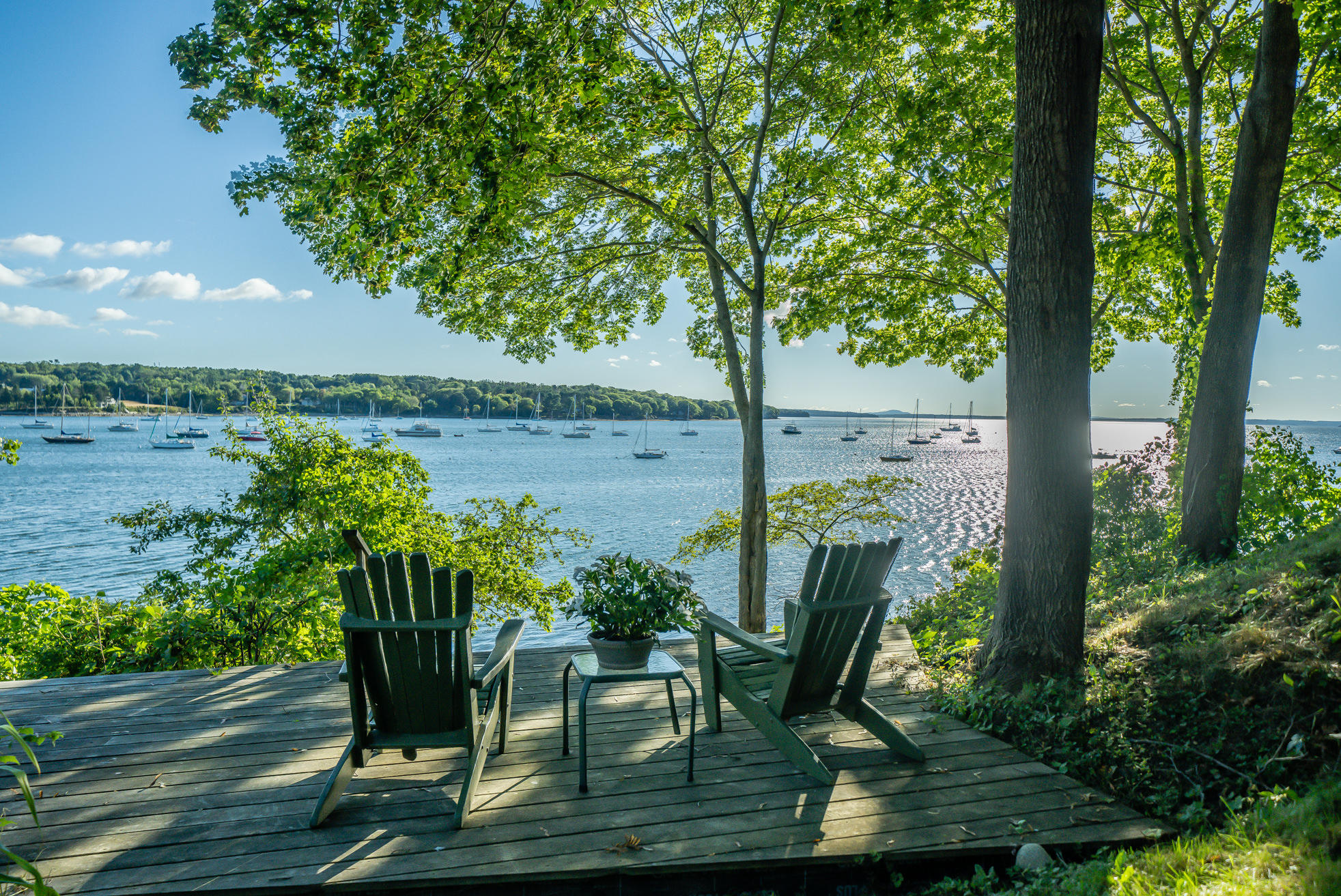 Watch your boat bob on its mooring from this private, in-town oceanfront home