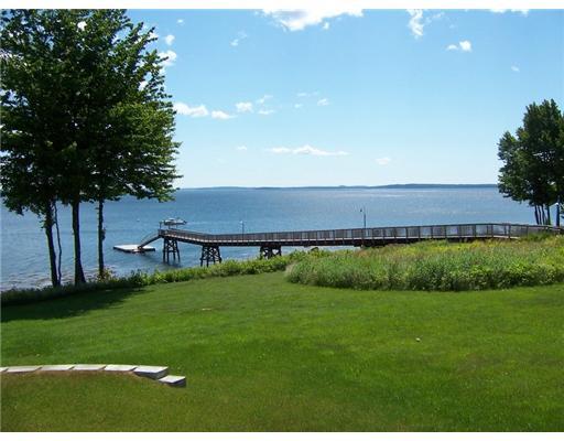 Real Estate Listing - Belfast, Maine - Beautiful oceanfront community with a shared 300' deepwater dock & float! Easy to maintain, close to town, boat mooring possible.
